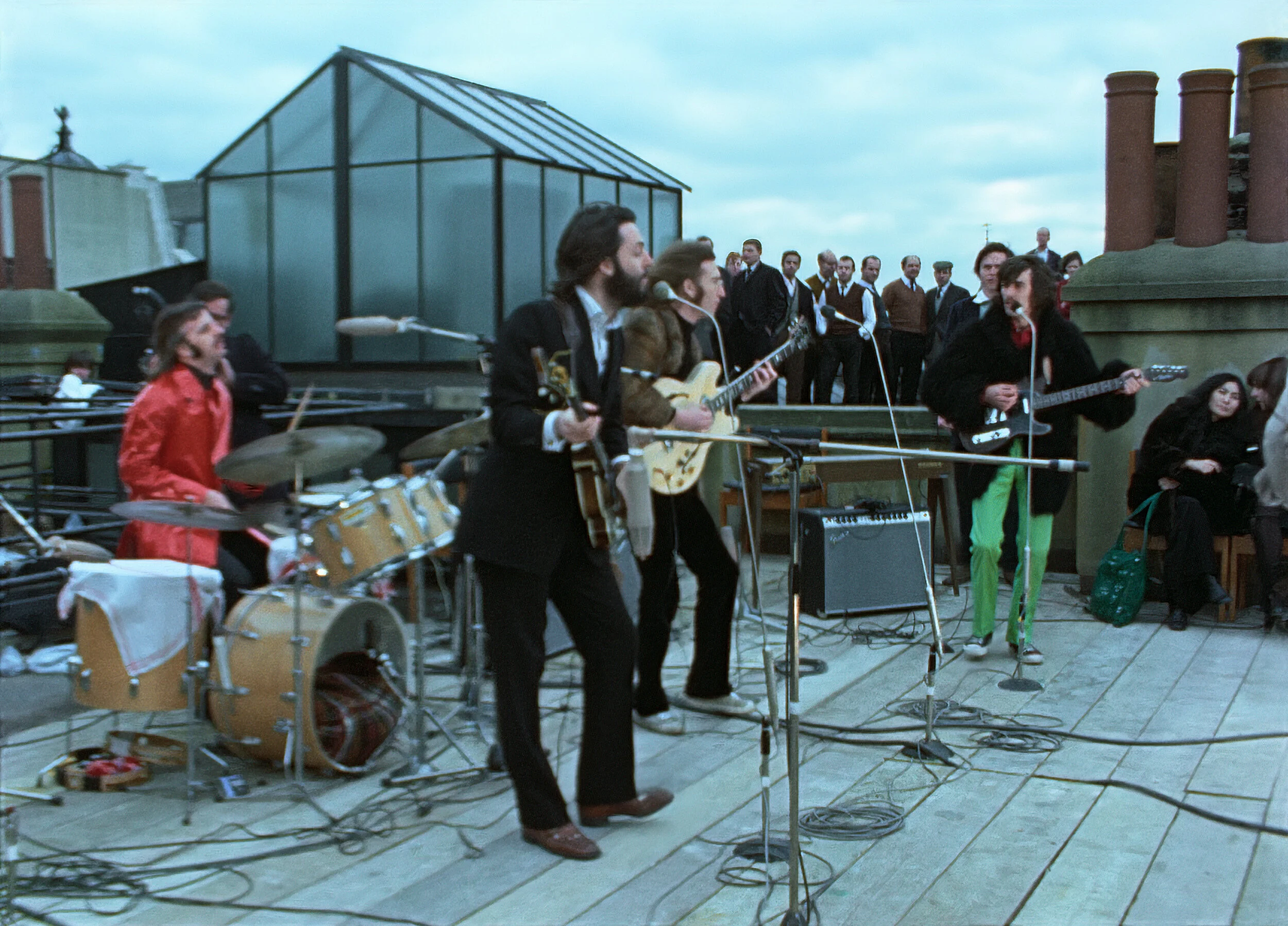 The Beatles performing on the rooftop of Apple Corps